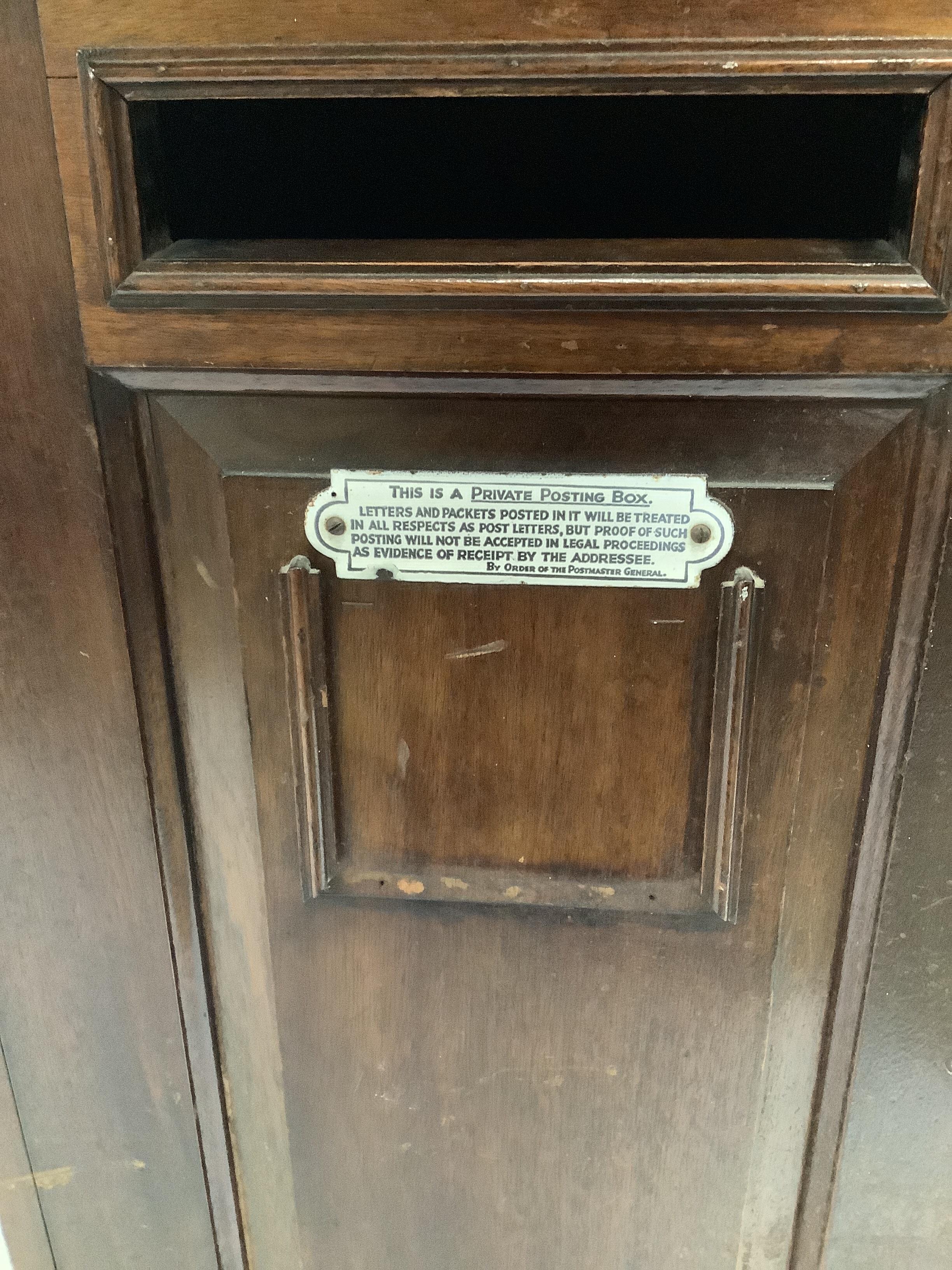 An early 20th century Hall Accessories Ltd., mahogany telephone/internal posting box, width 49cm, depth 35cm, height 148cm